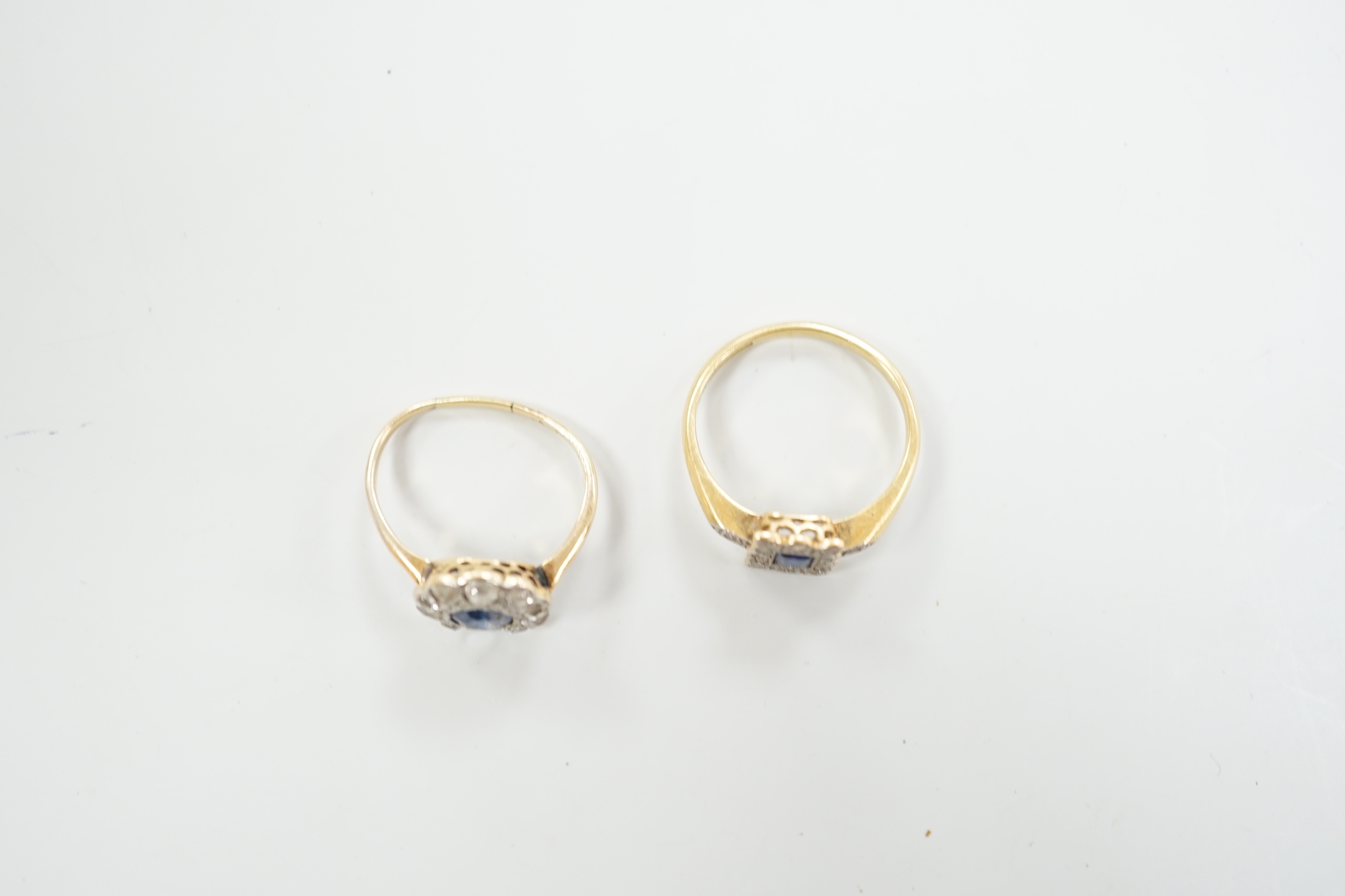 Two 1920's 18ct, sapphire and diamond cluster set dress rings, (one with misshapen shank and missing a diamond), gross weight 6.1 grams.
